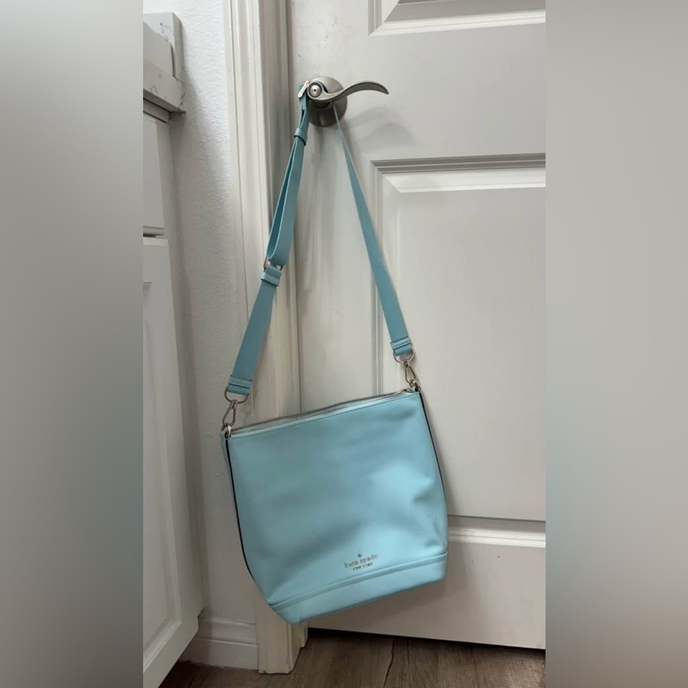 Kate Spade cross body bag in light blue.